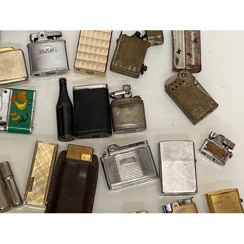 486 - A collection of pocket and table cigarette lighters some in original packaging, 44 in all.

This lot... 