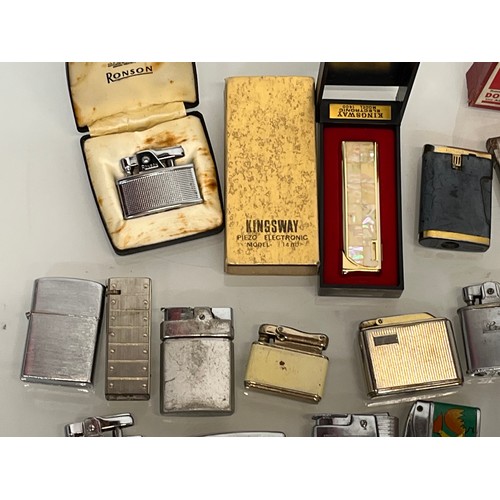 486 - A collection of pocket and table cigarette lighters some in original packaging, 44 in all.

This lot... 