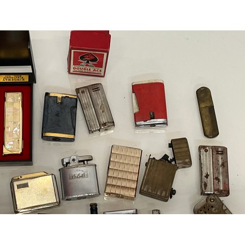 486 - A collection of pocket and table cigarette lighters some in original packaging, 44 in all.

This lot... 