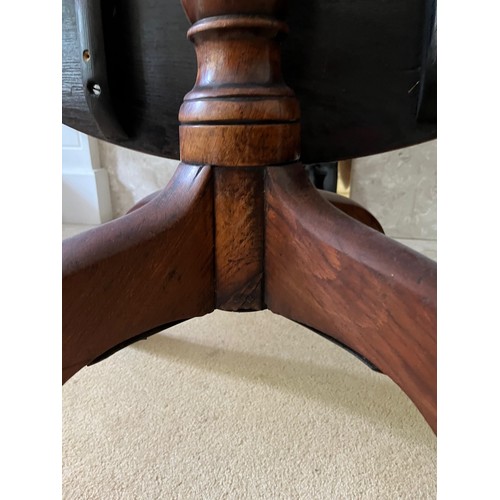 130 - Mahogany tilt top dinning table,

This lot is collection only