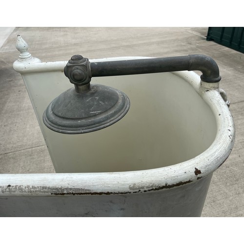 132 - Architectural salvage, cast iron bath fittings. Early C20th brass bathroom shower unit for a roll to... 