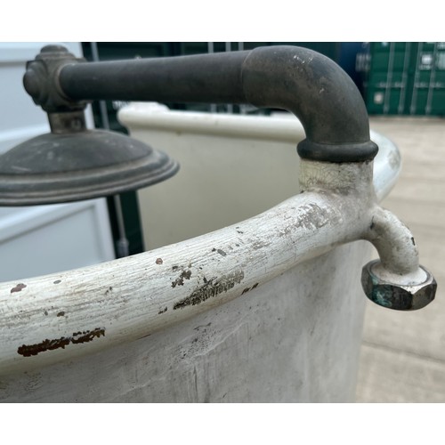 132 - Architectural salvage, cast iron bath fittings. Early C20th brass bathroom shower unit for a roll to... 