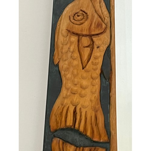 139 - Contempery hand carved wooden framed mirror, decorated with fish. 63 cm x 56 cm x 5 cm.

This lot is... 