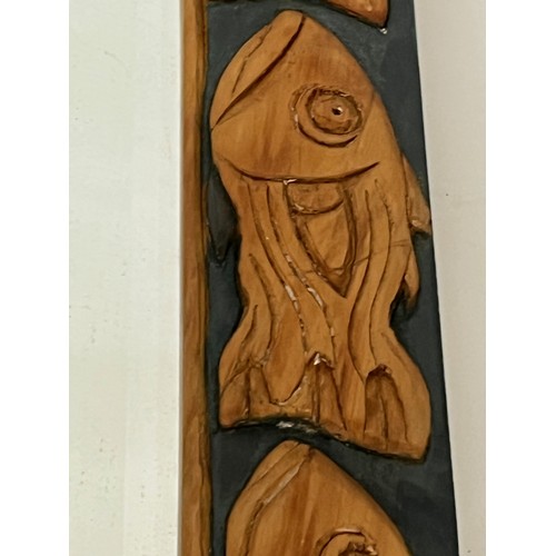 139 - Contempery hand carved wooden framed mirror, decorated with fish. 63 cm x 56 cm x 5 cm.

This lot is... 