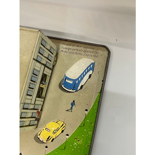 375 - Lithographed tinplate clock work model Airport with circling plane, in original box. 38 cm x 25 cm.
... 