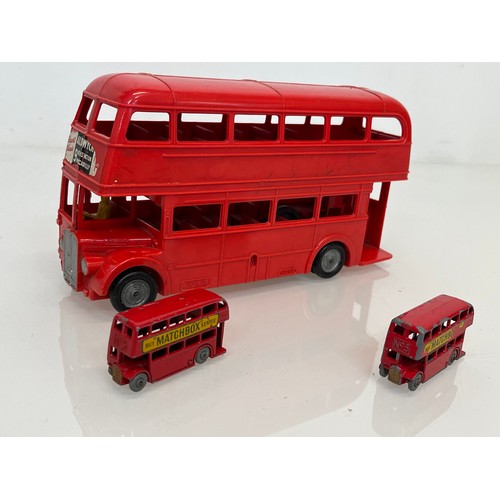 180 - Two diecast Matchbox toy buses and a large plastic Mettoy model of a London Routemaster Bus. 

This ... 