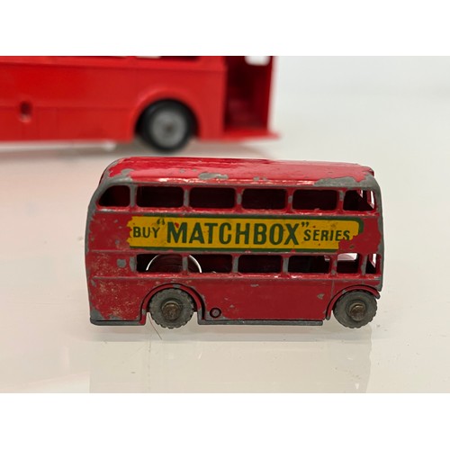 180 - Two diecast Matchbox toy buses and a large plastic Mettoy model of a London Routemaster Bus. 

This ... 
