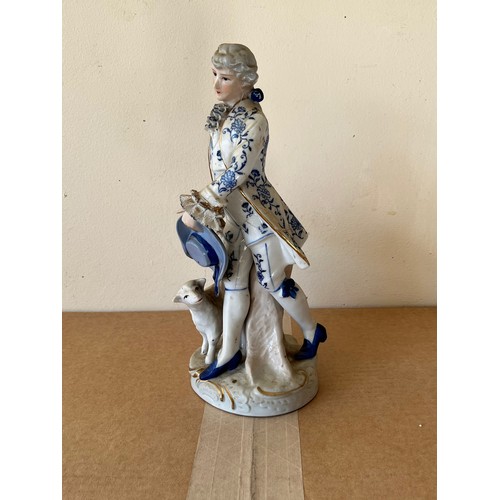 276 - Porcelain figurine marked with a crown to the base.

This lot is available for in-house shipping