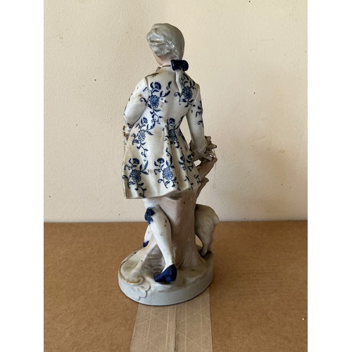 276 - Porcelain figurine marked with a crown to the base.

This lot is available for in-house shipping