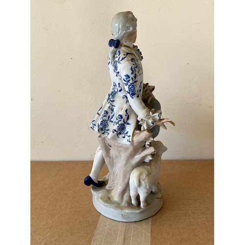 276 - Porcelain figurine marked with a crown to the base.

This lot is available for in-house shipping