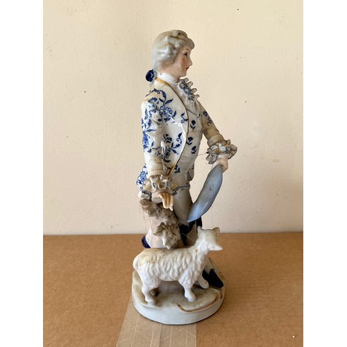 276 - Porcelain figurine marked with a crown to the base.

This lot is available for in-house shipping