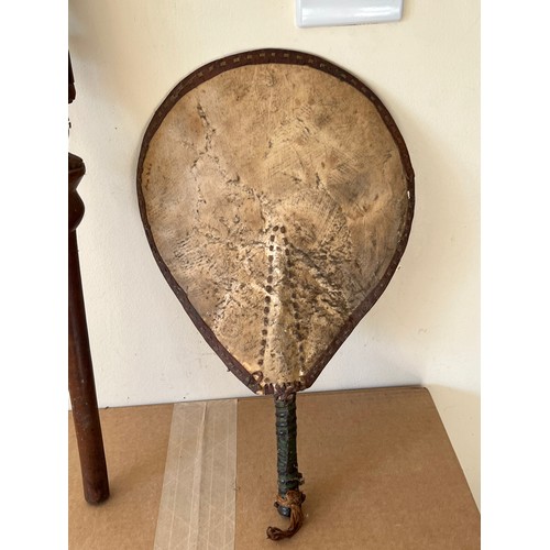 277 - Variety of tribal art pieces, an Armadillo bag, a stick carved with a military figure and a hide fan... 