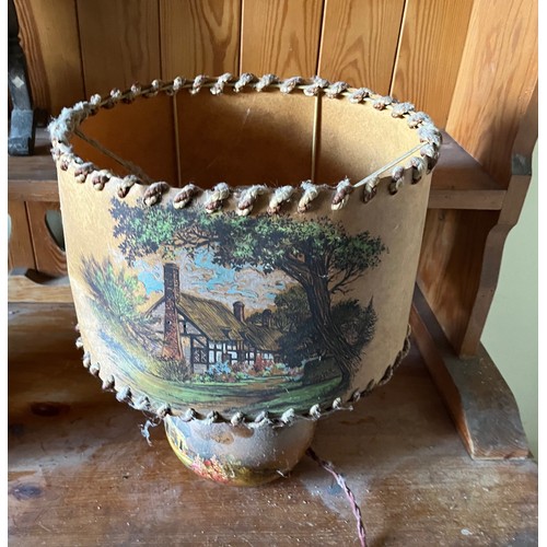 281 - Table lamp with English cottage scenes decorating the shade and the wooden base.

This lot is availa... 