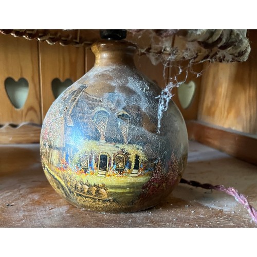 281 - Table lamp with English cottage scenes decorating the shade and the wooden base.

This lot is availa... 