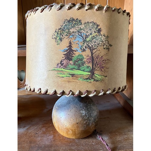 281 - Table lamp with English cottage scenes decorating the shade and the wooden base.

This lot is availa... 