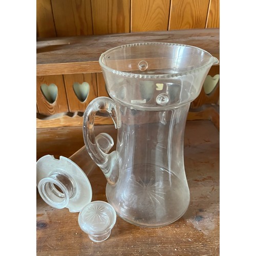 282 - An Edwardian clear glass cooling jug with wheel cut decoration.

This lot is available for in-house ... 