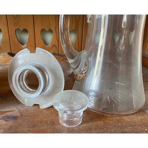 282 - An Edwardian clear glass cooling jug with wheel cut decoration.

This lot is available for in-house ... 