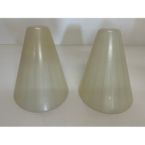 284 - A pair of mid century glass shades 15 cm high.

This lot is available for in-house shipping