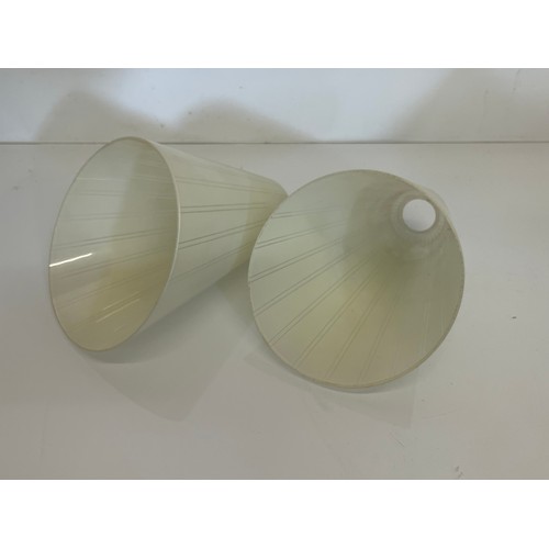 284 - A pair of mid century glass shades 15 cm high.

This lot is available for in-house shipping