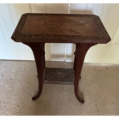 35 - A two tier side table with carved Chinoserie decoration of a Dragon and Turtles, 41 cm x 26 cm x 51.... 