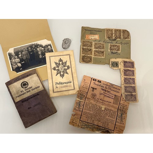 314 - Militaria, German WWI veterans ephemera, membership papers, badge, photographs and a Nazi WWII ratio... 