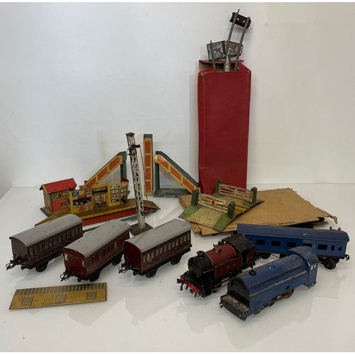 317 - A Hornby O gauge tinplate train set and accessories. Original 101 LMS set box has been used to store... 