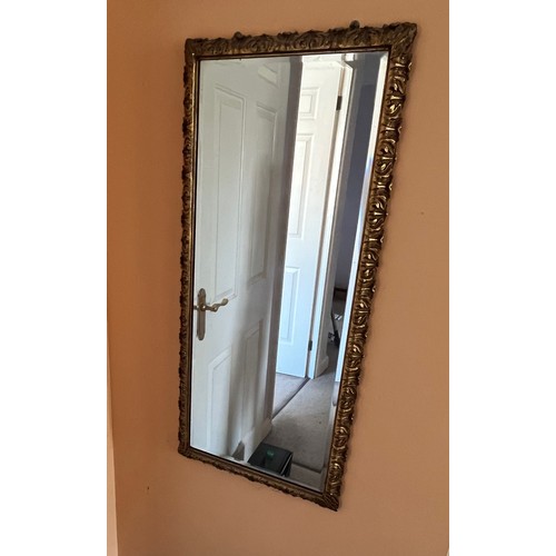 337 - A bevel edged gilt framed wall mirror, 44 cm x 98 cm.

This lot is collection only