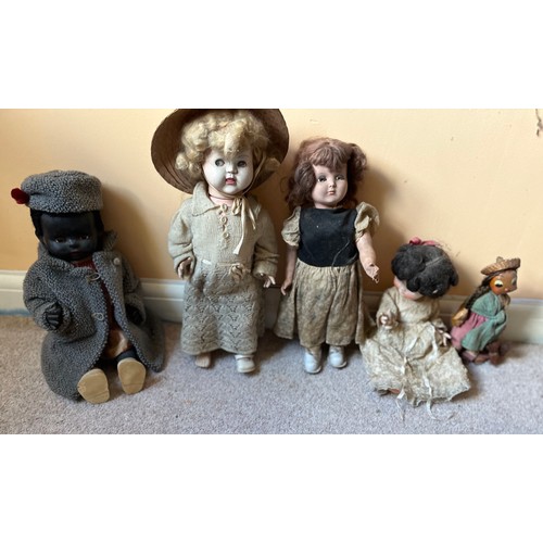 343 - Vintage dolls, unusual black doll wearing Amanda Jane hat and coat, and four other dolls.

This lot ... 