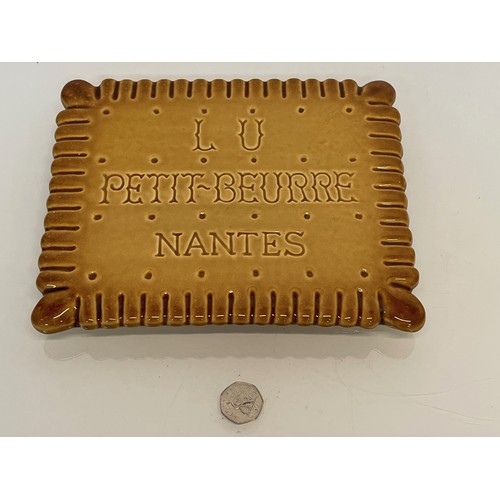 353 - Ceramic advertising French biscuit shaped promotional platter 25 cm x 20 cm.

This lot is available ... 