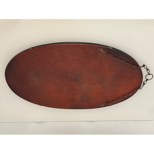 385 - Bevel edged oval wall mirror. 55 cm x 32.5cm, can be hung in a portrait or landscape style.

This lo... 