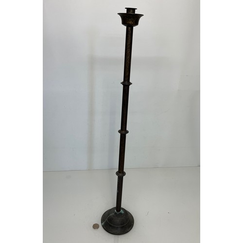 17 - A patinated brass candle stand 83 cm tall.

This lot is available for in-house shipping