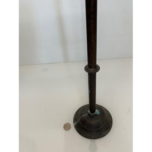 17 - A patinated brass candle stand 83 cm tall.

This lot is available for in-house shipping