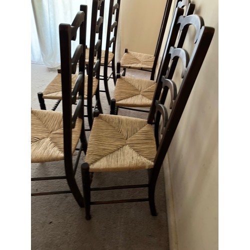 52 - Six rush seated dinning chairs.

This lot is collection only.