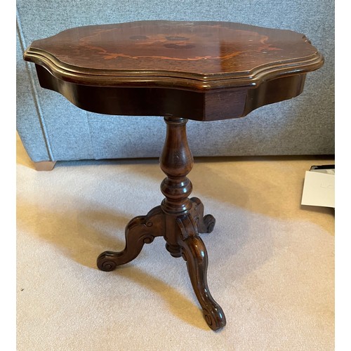 58 - Inlaid side table raised on a single column support with three feet. 54 cm wide and 63 cm tall.

Thi... 