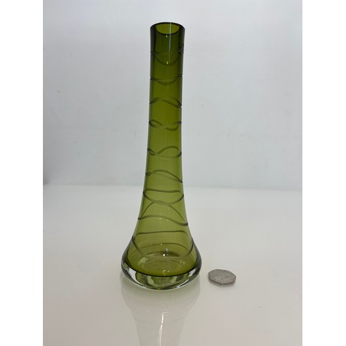 145 - Mid century green art glass vase with wheel cut decoration. 23 cm high

This lot is available for in... 