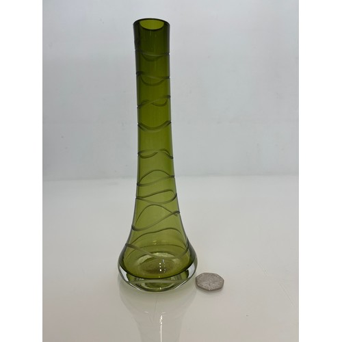 145 - Mid century green art glass vase with wheel cut decoration. 23 cm high

This lot is available for in... 