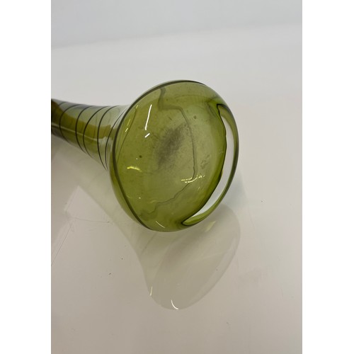 145 - Mid century green art glass vase with wheel cut decoration. 23 cm high

This lot is available for in... 