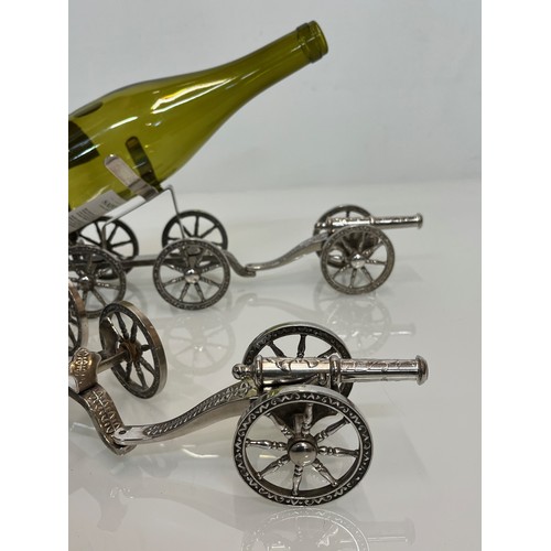 146 - English Silver plate wine bottle gun carriage for the dining table and another.

This lot is availab... 