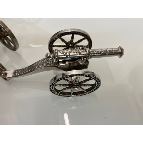 146 - English Silver plate wine bottle gun carriage for the dining table and another.

This lot is availab... 