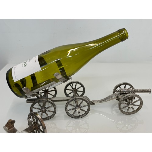 146 - English Silver plate wine bottle gun carriage for the dining table and another.

This lot is availab... 