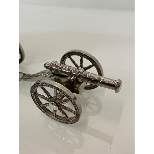 146 - English Silver plate wine bottle gun carriage for the dining table and another.

This lot is availab... 