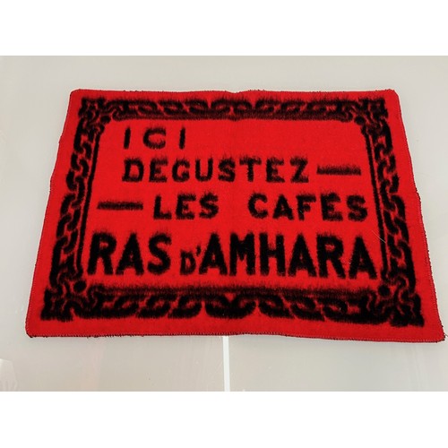 159 - A woven mat advertising Coffee Ras D’Amhara. 58 cm x 43 cm.

This lot is available for in-house ship... 