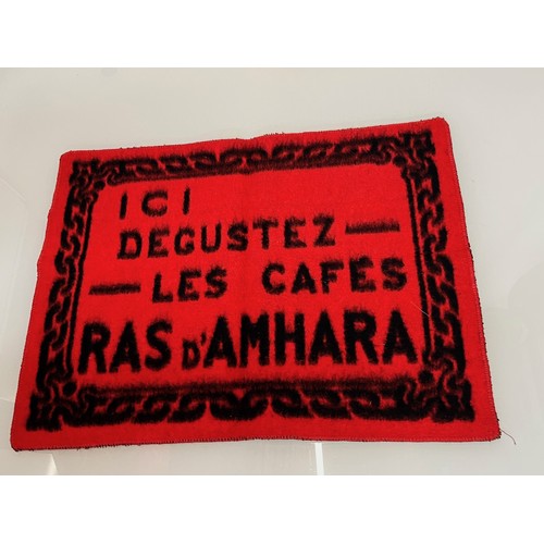 159 - A woven mat advertising Coffee Ras D’Amhara. 58 cm x 43 cm.

This lot is available for in-house ship... 