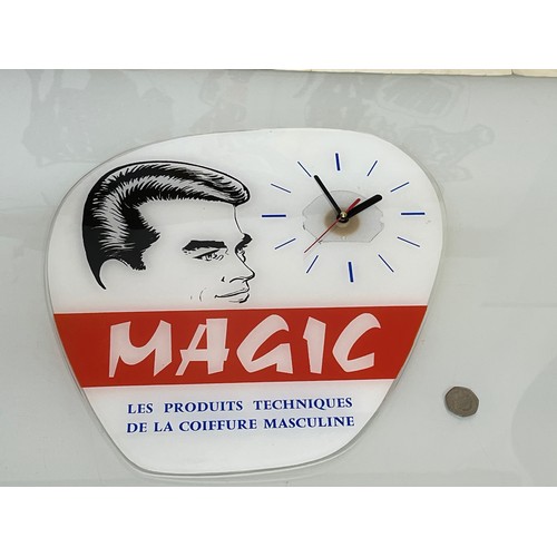 162 - Hair salon wall clock advertising Magic brand of male grooming products. 34 cm x 34 cm.

This lot is... 