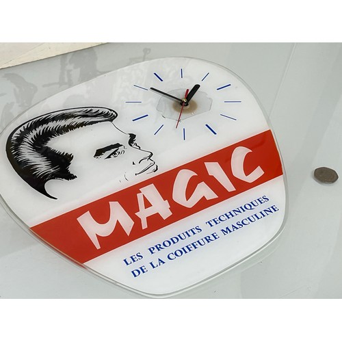 162 - Hair salon wall clock advertising Magic brand of male grooming products. 34 cm x 34 cm.

This lot is... 