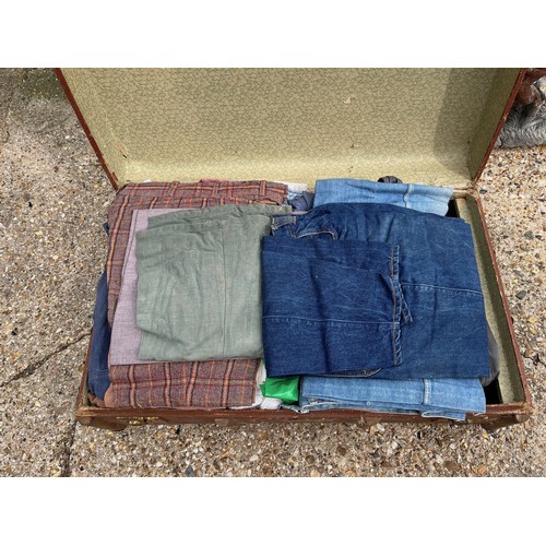 164 - Trunk of clothing, old bell bottom jeans etc.

This lot is collection only