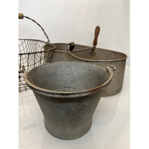 167 - A galvinised seed sewing bucket, a galvinised pail and a wire potato basket.

This lot is collection... 