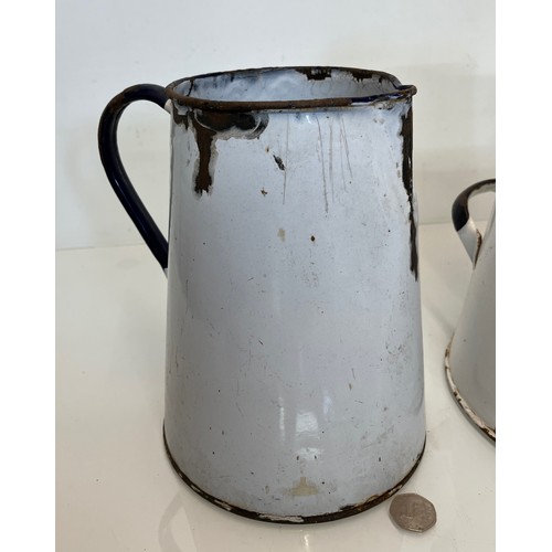 168 - Two vitrous enamels jugs. 28 cm tall and 23cm tall.

This lot is available for in-house shipping