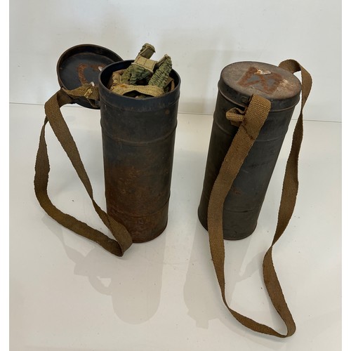 174 - Two military gas mask tins one with mask inside.

This lot is available for in-house shipping