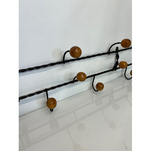 175 - Wrought iron mid century coat hanging rails, 107cm long 35 cm high.

This lot is collection only.